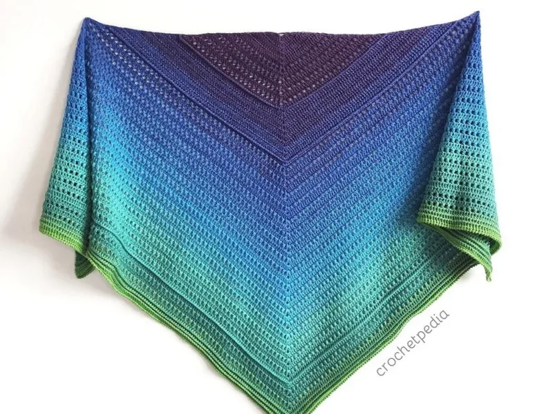 Gradient puff stitch shawl worked from a magic ring center