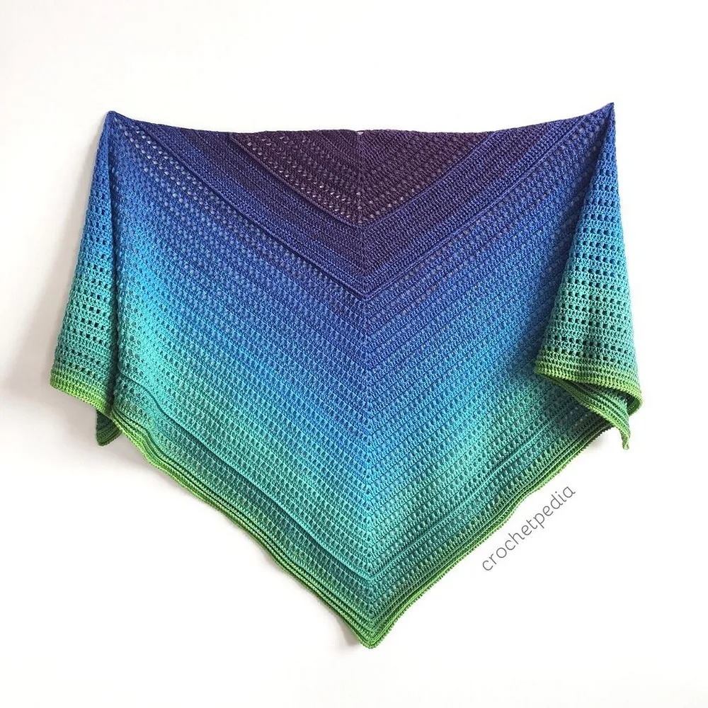 Gradient puff stitch shawl worked from a magic ring center