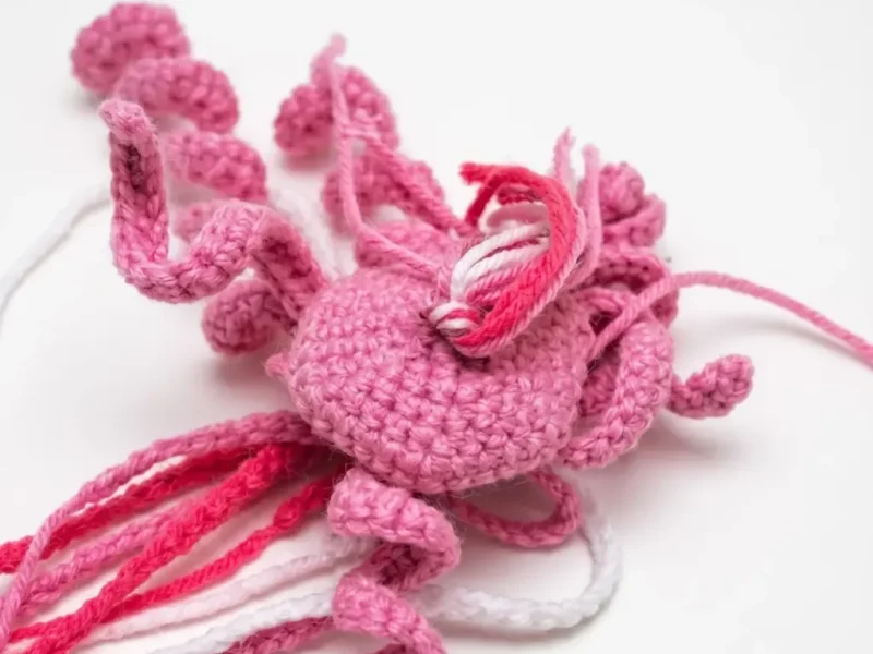 Jellyfish amigurumi with curly tentacles and a domed cap
