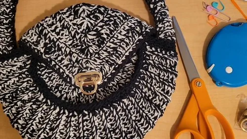 Two-strand crochet purse with flap and straps